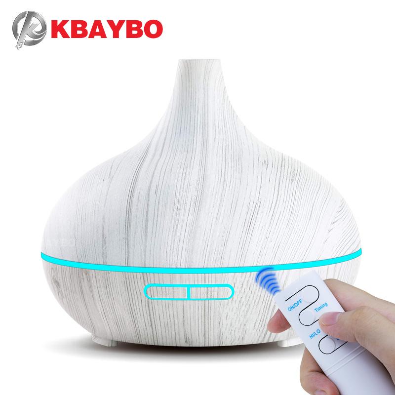 KBAYBO 550ml Ultrasonic Electric Air Humidifier in white wood grain design, emitting cool mist and featuring LED lights.